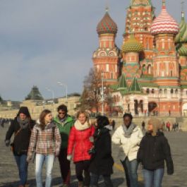 A "Comrade Group" walks to the Kremlin with St. Basil's Cathedral in the background